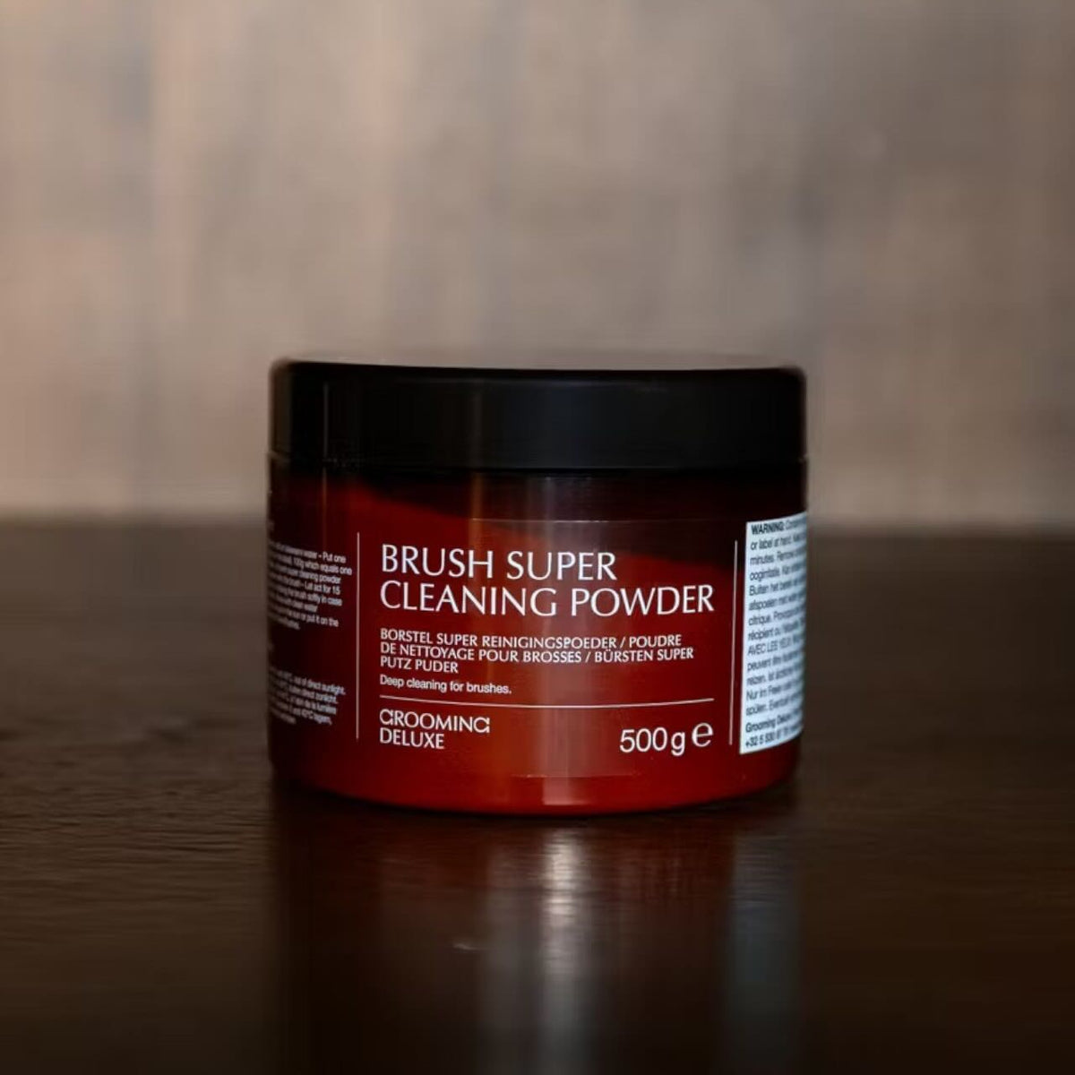 Grooming Deluxe Reinigungspulver für Bürsten Extra Stark Reinigungsmittel, 500 g, Produkt allein auf Tisch.